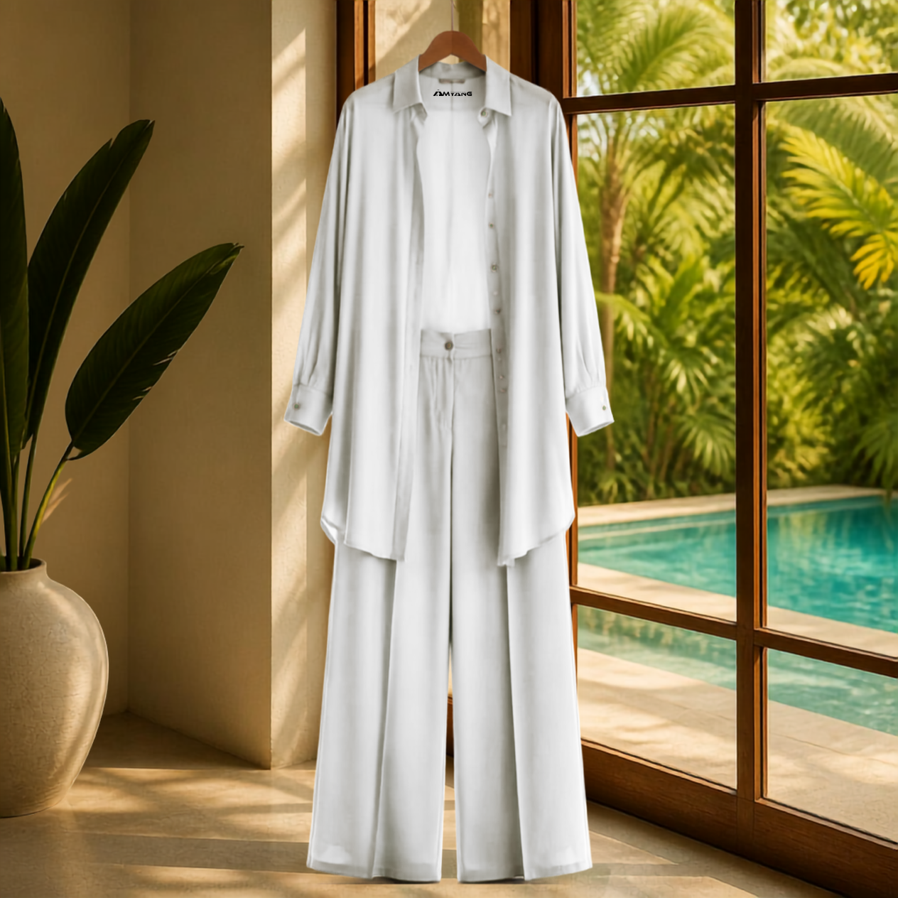 A Soft Elegance Set- Kaftan Top and Pant, showcasing a vibrant matching kaftan set African outfit in white. This elegant african-inspired two piece set features a sheer kaftan shirt and stylish pants, highlighting the subtle beauty of women attire. The outfit reflects a modern west african suit styling and embodies the essence of west african fashion, making it a perfect choice for various occasions. Explore the charm of african kaftan styles for ladies with this stunning look.