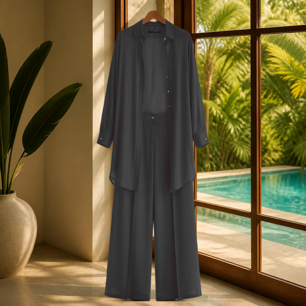 A Soft Elegance Set- Kaftan Top and Pant, showcasing a classic matching kaftan set African outfit in black. This elegant african-inspired two piece set features a sheer kaftan shirt and stylish pants, highlighting the subtle beauty of women attire. The outfit reflects a modern west african suit styling and embodies the essence of west african fashion, making it a perfect choice for various occasions. Explore the charm of african kaftan styles for ladies with this stunning look.