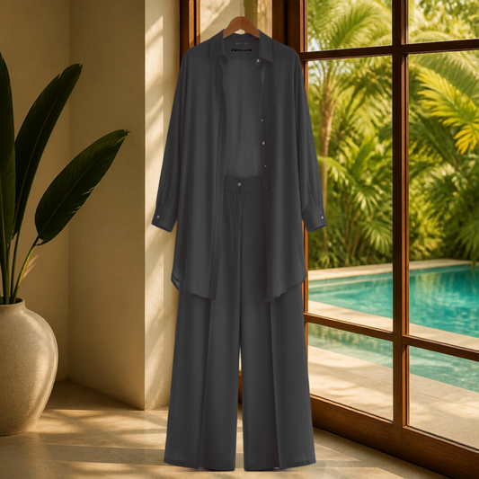A Soft Elegance Set- Kaftan Top and Pant, showcasing a classic matching kaftan set African outfit in black. This elegant african-inspired two piece set features a sheer kaftan shirt and stylish pants, highlighting the subtle beauty of women attire. The outfit reflects a modern west african suit styling and embodies the essence of west african fashion, making it a perfect choice for various occasions. Explore the charm of african kaftan styles for ladies with this stunning look.